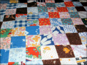 A patchwork quilt top made by Hessie Hammond with flour sack fabrics