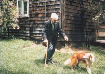 John Hammond, circa 1973, outside his Hampton home with his dog Prince